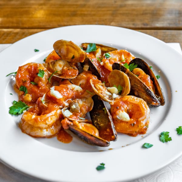 Danny's Pizzeria's seafood dish with shrimp, mussels, and clams in a red sauce.